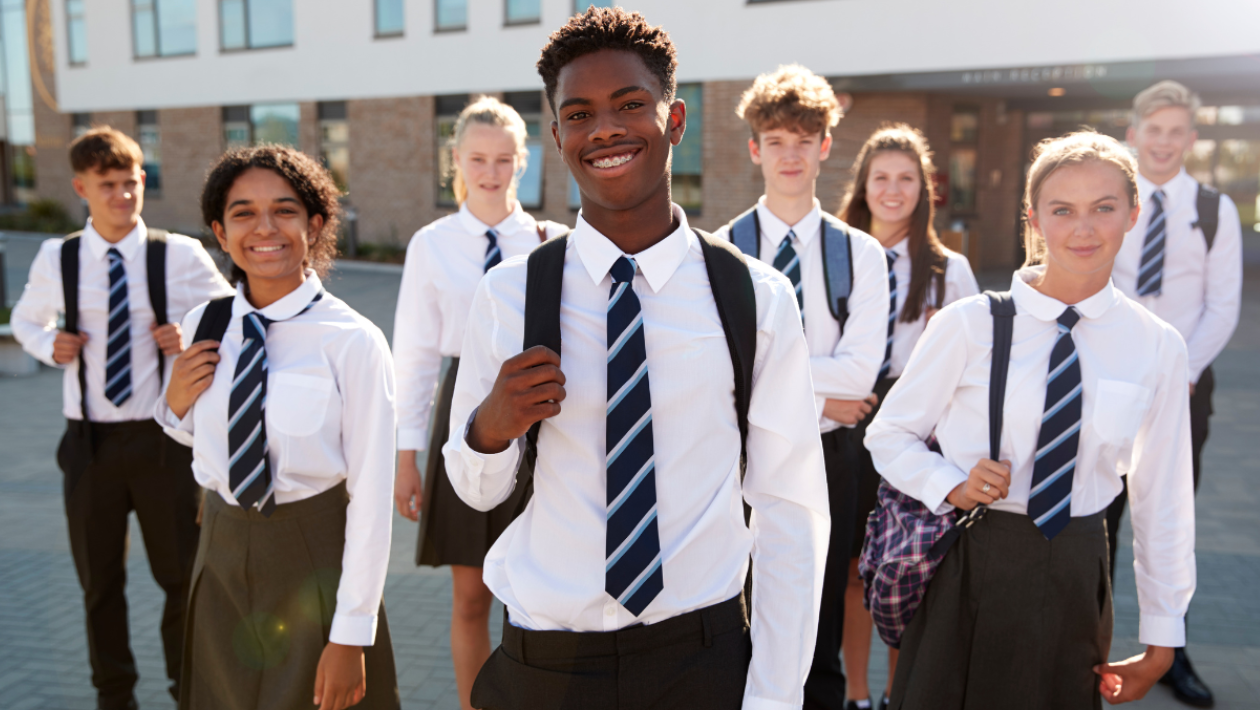 A group of school students posing for the camera