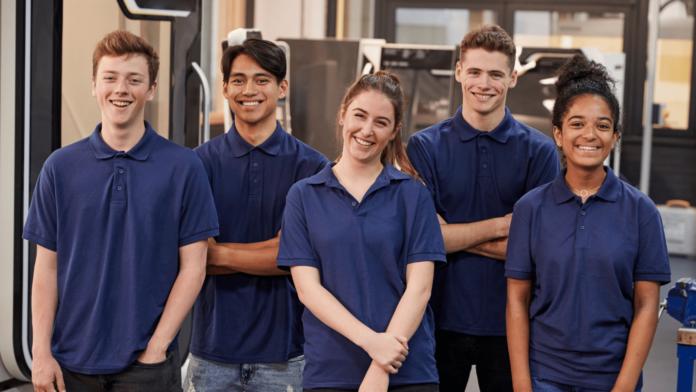 five apprentices posing at the camera