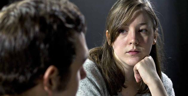 Young woman talking to a man