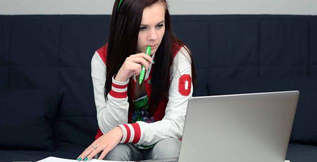 Young woman looking at a laptop