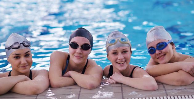 Four girls at a swimming pool