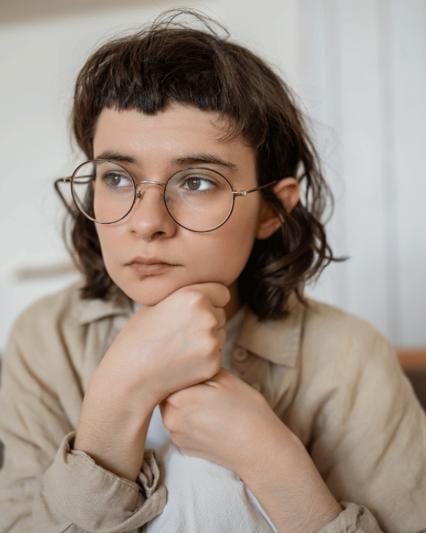 young person sat looking away from camera