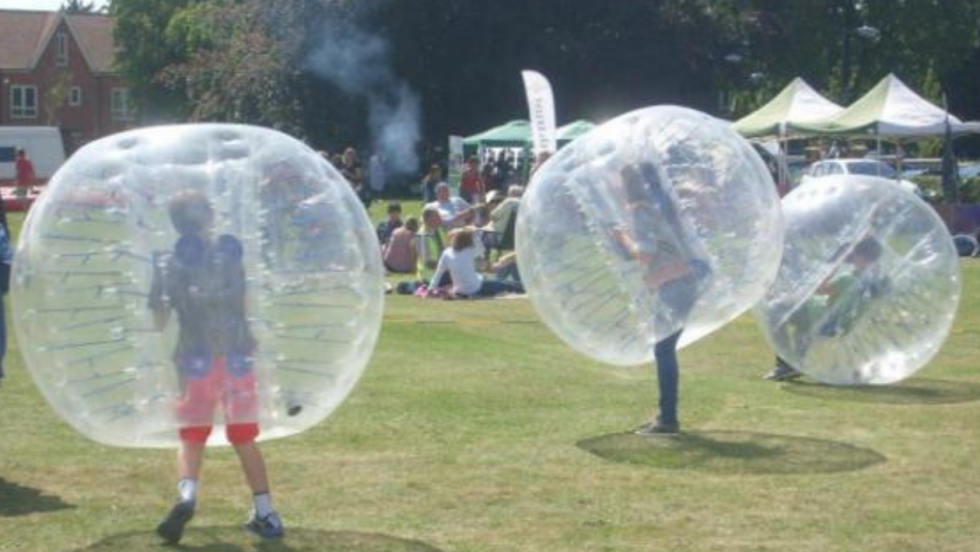 Boys in bubble in park
