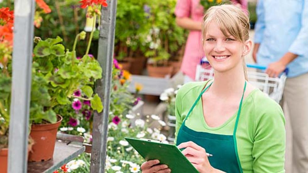 Young woman working at a garden centre