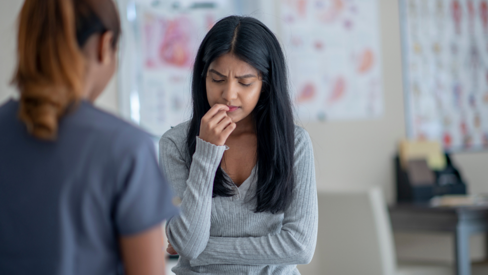 young person talking to school health nurse