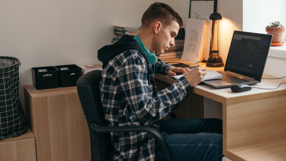 teenager sat at desk