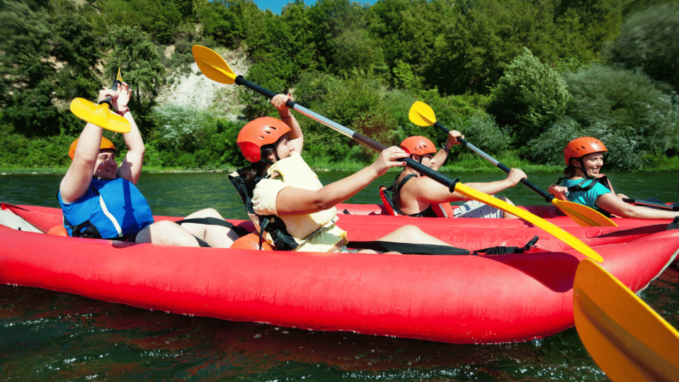Young people in boats on a river