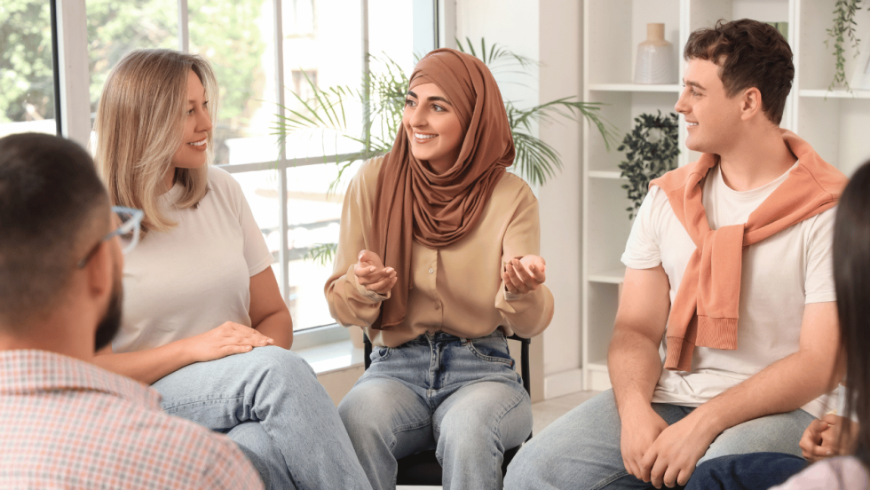 4 young people sat talking