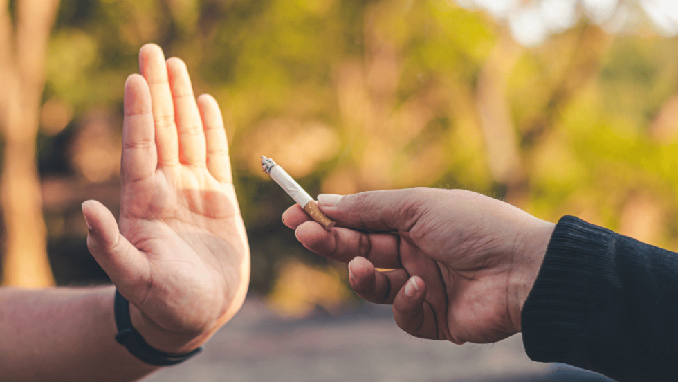 Hand saying no to smoking
