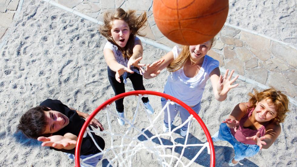 Young people playing basketball