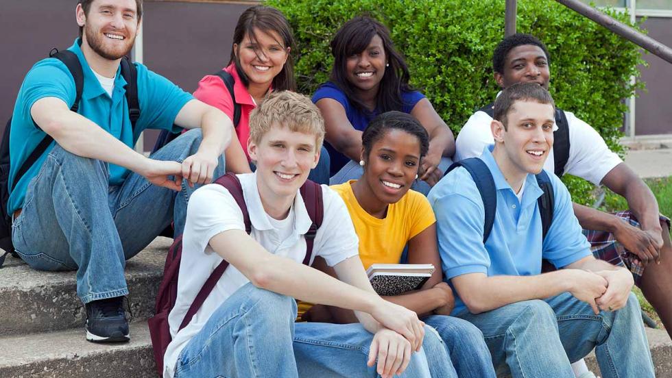 College students sat on stairs