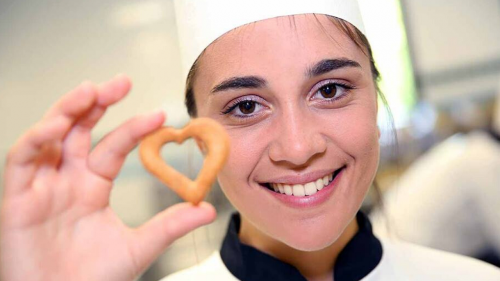 girl holding cookie