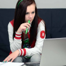 girl sat at laptop  