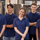 five apprentices posing at the camera
