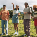 four teenagers stood outside together.png