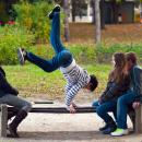 Young people practising parkour in a park